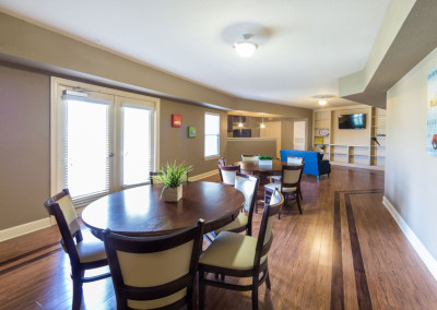 Community room at the Villages at Ben White with wooden tables