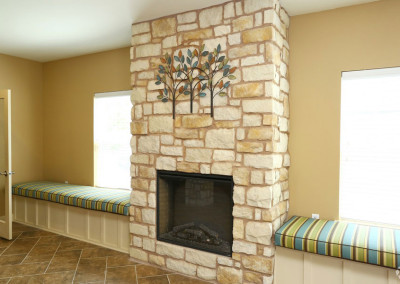 Stone fireplace at the Villages at Ben White lobby