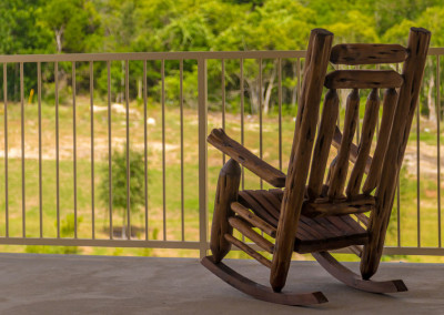 Patio area at The Villages at Ben White with wooden rocking chair